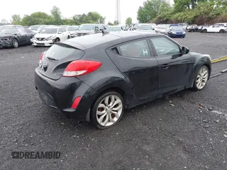 2012 Hyundai Veloster w/Gray Int z VIN KMHTC6AD0CU080630, wystawiony jako IAAI lot #42191015 z przebiegiem 48 405 mil mil oraz . Historia ofert i sprzedaży dostępna na DreamBid. Obrazek 4.