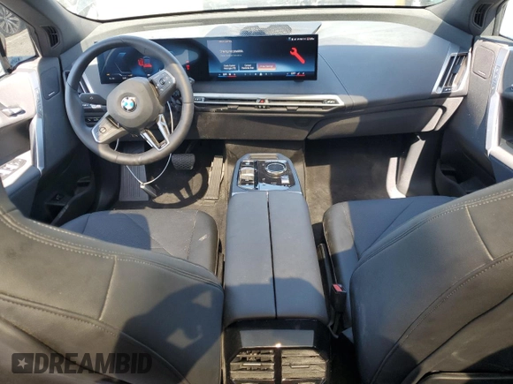 2025 BMW iX xDrive50 z VIN WB523CF02SCS06555, wystawiony jako Copart lot #55291115 z przebiegiem Nie podano mil oraz Szkoda całkowita • Salvage title. Historia ofert i sprzedaży dostępna na DreamBid. Obrazek 8.