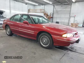 1997 Pontiac Bonneville SE z VIN 1G2HX52K5VH261373, wystawiony jako IAAI lot #40736098 z przebiegiem 144 314 mil mil oraz . Historia ofert i sprzedaży dostępna na DreamBid. Obrazek 1.