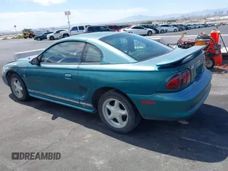 1997 Ford Mustang with VIN 1FALP4049VF200422, listed as a IAAI auction lot 42073947 with 157,937 mi miles. Bid and sale history available at carsss.com. Image 3.