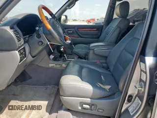 2001 Lexus LX 470 z VIN JTJHT00W313504330, wystawiony jako Copart lot #61126435 z przebiegiem 87 049 mil mil oraz Czysty tytuł • Clean title. Historia ofert i sprzedaży dostępna na DreamBid. Obrazek 7.