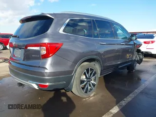 2019 Honda Pilot Touring 7-Passenger z VIN 5FNYF5H65KB020420, wystawiony jako IAAI lot #41575972 z przebiegiem 48 950 mil mil oraz . Historia ofert i sprzedaży dostępna na DreamBid. Obrazek 4.