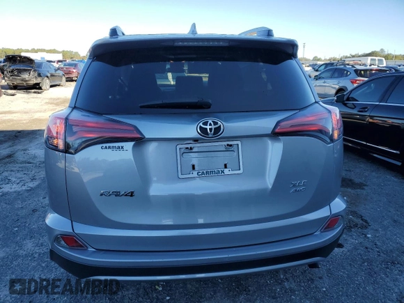 2018 Toyota RAV4 XLE with VIN 2T3RFREV8JW725504, listed as a Copart auction lot 84792264 with 41,501 mi miles and Salvage Title. Bid and sale history available at carsss.com. Image 6.
