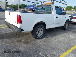 2002 Ford F-150 XL with VIN 1FTRF17W52NB71693, listed as a IAAI auction lot 41952405 with 121,917 mi miles. Bid and sale history available at carsss.com. Image 4.