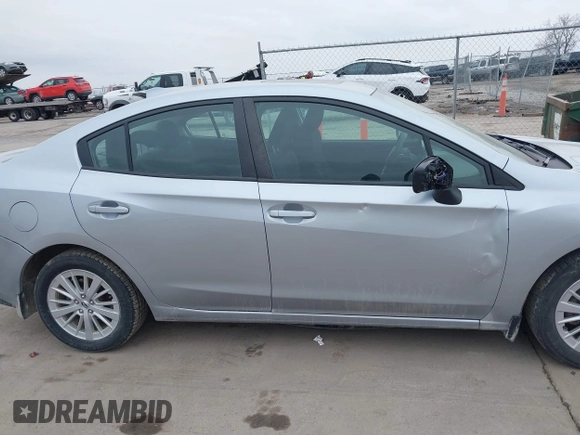 2018 Subaru Impreza Premium z VIN 4S3GKAD67J3604898, wystawiony jako IAAI lot #41694176 z przebiegiem 97 287 mil mil oraz . Historia ofert i sprzedaży dostępna na DreamBid. Obrazek 13.