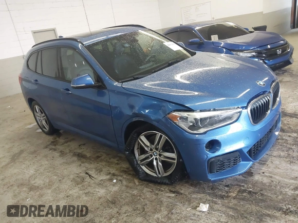 2019 BMW X1 xDrive28i with VIN WBXHT3C53K5L36690, listed as a IAAI auction lot 42012992 with 70,339 mi miles. Bid and sale history available at carsss.com. Image 1.