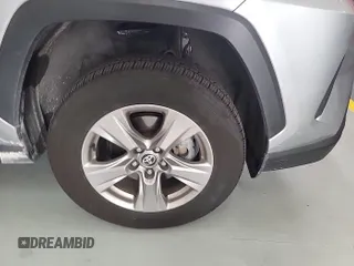 2023 Toyota RAV4 Hybrid XLE with VIN 2T3RWRFV9PW175446, listed as a IAAI auction lot 42806880 with 90,261 mi miles and . Bid and sale history available at DreamBid. Image 24.