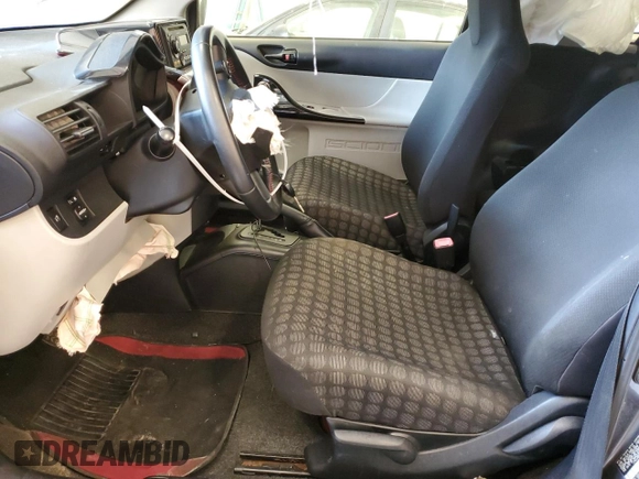 2012 Scion iQ with VIN JTNJJXB07CJ018013, listed as a Copart auction lot 57101085 with 91,370 mi miles and Non repairable. Bid and sale history available at DreamBid. Image 7.