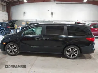 2021 Honda Odyssey Touring z VIN 5FNRL6H83MB028264, wystawiony jako IAAI lot #42206204 z przebiegiem 45 332 mil mil oraz . Historia ofert i sprzedaży dostępna na DreamBid. Obrazek 14.