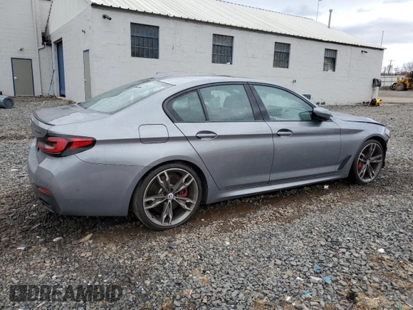 2023 BMW 5 Series M550i xDrive with VIN WBA13BK06PCN02733, listed as a Copart auction lot 48767235 with 27,725 mi miles and Salvage title. Bid and sale history available at DreamBid. Image 3.