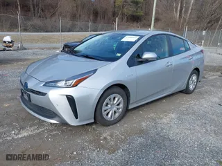 2021 Toyota Prius L Eco with VIN JTDKAMFU7M3143961, listed as a IAAI auction lot 41486032 with 58,979 mi miles. Bid and sale history available at carsss.com. Image 18.