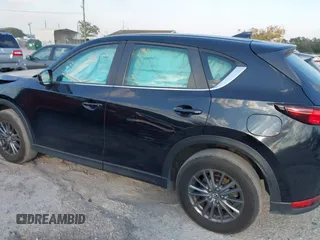 2019 Mazda CX-5 Sport with VIN JM3KFABMXK0693540, listed as a IAAI auction lot 41523569 with 57,895 mi miles and . Bid and sale history available at DreamBid. Image 3.