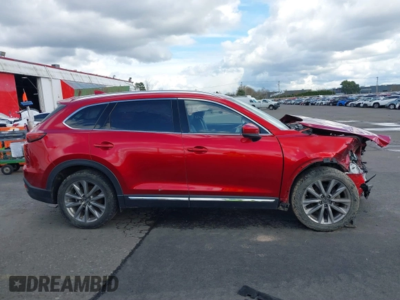 2020 Mazda CX-9 Grand Touring with VIN JM3TCBDY4L0423563, listed as a IAAI auction lot 41829394 with 76,704 mi miles and . Bid and sale history available at DreamBid. Image 14.