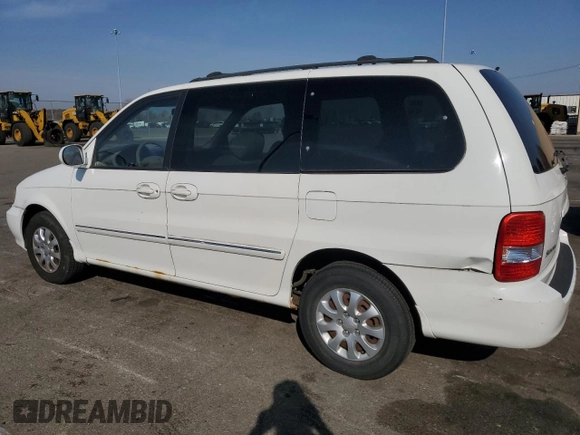 2005 Kia Sedona LX with VIN KNDUP132056685525, listed as a Copart auction lot 77790354 with 60,985 mi miles and Salvage Title. Bid and sale history available at carsss.com. Image 2.