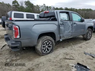 2022 GMC Canyon 4WD AT4 z VIN 1GTG6FENXN1274389, wystawiony jako Copart lot #85255404 z przebiegiem 42 843 mil mil oraz Szkoda całkowita • Salvage title. Historia ofert i sprzedaży dostępna na DreamBid. Obrazek 3.