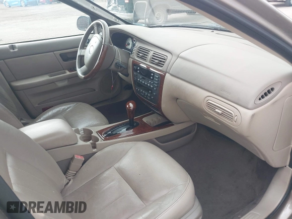 2005 Mercury Sable LS z VIN 1MEFM55S85A605535, wystawiony jako IAAI lot #42490113 z przebiegiem 112 031 mil mil oraz . Historia ofert i sprzedaży dostępna na DreamBid. Obrazek 5.