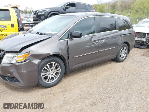 2011 Honda Odyssey EX-L with VIN 5FNRL5H68BB100274, listed as a IAAI auction lot 42159787 with 205,616 mi miles and . Bid and sale history available at carsss.com. Image 2.