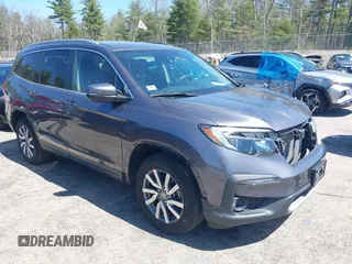2021 Honda Pilot EX-L z VIN 5FNYF6H59MB016354, wystawiony jako IAAI lot #42108020 z przebiegiem 61 436 mil mil oraz . Historia ofert i sprzedaży dostępna na DreamBid. Obrazek 1.