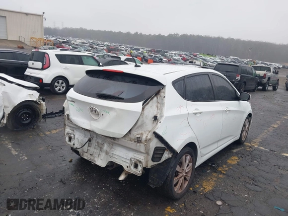 2014 Hyundai Accent SE with VIN KMHCU5AE8EU145629, listed as a IAAI auction lot 41497848 with 134,919 mi miles. Bid and sale history available at carsss.com. Image 4.