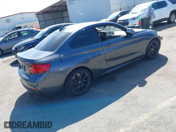 2014 BMW 2 Series M235i with VIN WBA1J7C51EVX33702, listed as a IAAI auction lot 41713337 with 83,076 mi miles. Bid and sale history available at carsss.com. Image 4.