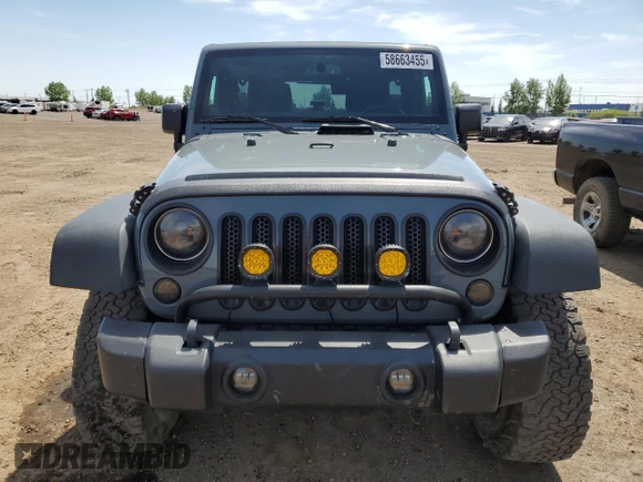 2014 Jeep Wrangler Unlimited Sahara with VIN 1C4BJWEG7EL228307, listed as a Copart auction lot 58663455 with 188,024 mi miles and Salvage title. Bid and sale history available at DreamBid. Image 5.