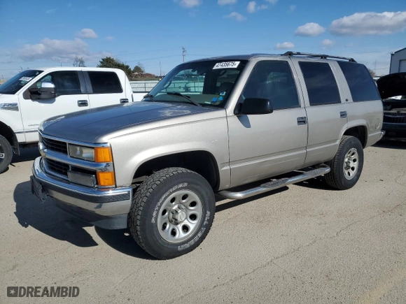 1999 Chevrolet Tahoe Z71 with VIN 1GNEK13R4XJ458295, listed as a Copart auction lot 47435675 with 211,422 mi miles and Salvage Title. Bid and sale history available at carsss.com. Image 1.