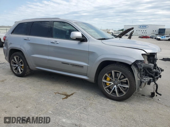 2018 Jeep Grand Cherokee Trackhawk with VIN 1C4RJFN91JC223825, listed as a Copart auction lot 58011465 with 83,177 mi miles and Salvage title. Bid and sale history available at DreamBid. Image 4.
