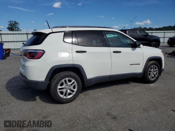 2018 Jeep Compass Sport with VIN 3C4NJCAB7JT140622, listed as a Copart auction lot 58162185 with 128,686 mi miles and Salvage title. Bid and sale history available at DreamBid. Image 3.