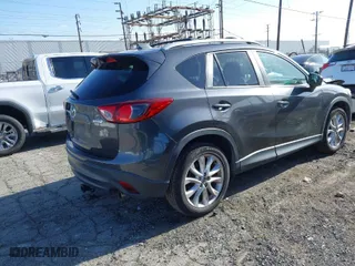 2014 Mazda CX-5 Grand Touring with VIN JM3KE2DY7E0405115, listed as a IAAI auction lot 41939899 with 147,452 mi miles. Bid and sale history available at carsss.com. Image 4.