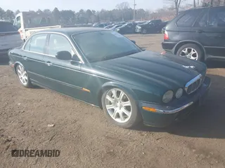 2004 Jaguar XJ with VIN SAJWA71C74SG22814, listed as a IAAI auction lot 41649399 with 114,841 mi miles. Bid and sale history available at carsss.com. Image 1.