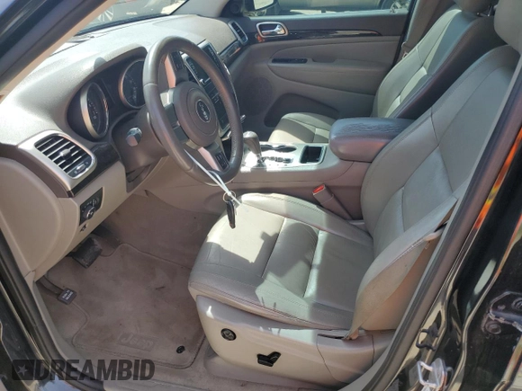 2013 Jeep Grand Cherokee Laredo with VIN 1C4RJEAG2DC519570, listed as a Copart auction lot 52066225 with 129,091 mi miles and Salvage Title. Bid and sale history available at carsss.com. Image 7.