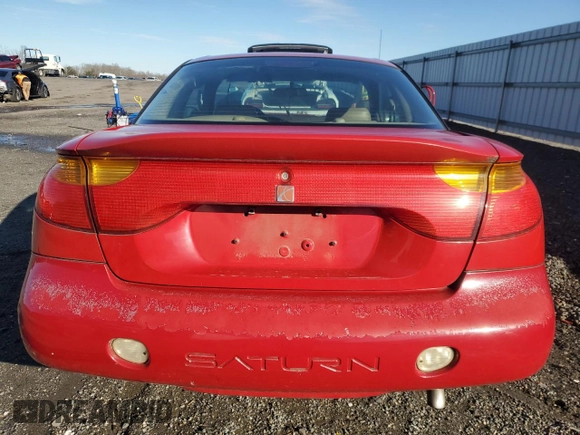2001 Saturn SC z VIN 1G8ZY12751Z284992, wystawiony jako Copart lot #87116694 z przebiegiem 134 690 mil mil oraz Tytuł czysty. Historia ofert i sprzedaży dostępna na DreamBid. Obrazek 6.