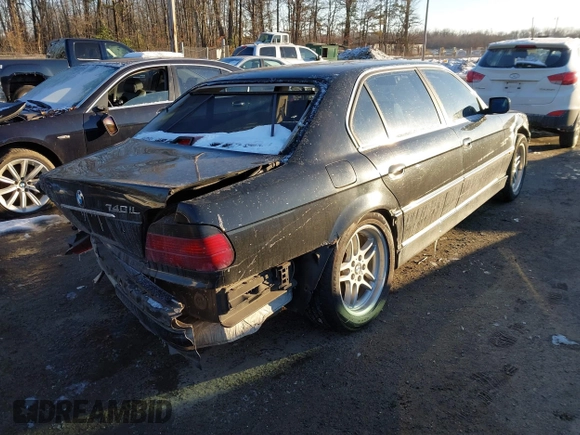 2000 BMW 7 Series 740iL with VIN WBAGH8345YDP12154, listed as a IAAI auction lot 41369212 with 210,094 mi miles. Bid and sale history available at carsss.com. Image 4.