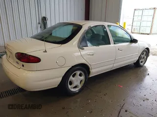 1997 Ford Contour LX with VIN 1FALP6537VK132379, listed as a IAAI auction lot 42771426 with 122,263 mi miles and . Bid and sale history available at DreamBid. Image 4.