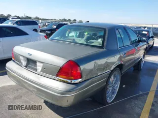2002 Ford Crown Victoria Police Police Interceptor with VIN 2FAFP71W52X143053, listed as a IAAI auction lot 41594827 with 210,078 mi miles. Bid and sale history available at carsss.com. Image 4.