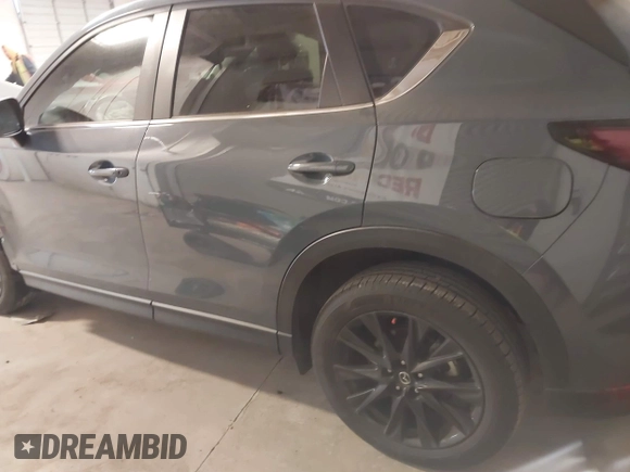 2021 Mazda CX-5 Touring with VIN JM3KFACM9M0379508, listed as a IAAI auction lot 41577251 with 46,519 mi miles. Bid and sale history available at carsss.com. Image 14.