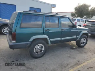 1998 Jeep Cherokee Sport with VIN 1J4FT68S2WL236774, listed as a Copart auction lot 77388734 with 128,591 mi miles and Clean Title. Bid and sale history available at carsss.com. Image 3.