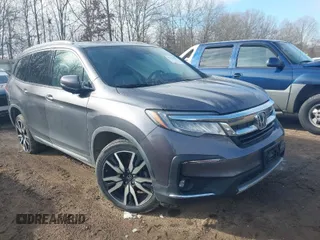 2019 Honda Pilot Touring 7-Passenger with VIN 5FNYF6H67KB018769, listed as a IAAI auction lot 41310452 with 92,499 mi miles. Bid and sale history available at carsss.com. Image 1.