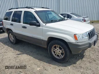 2003 Jeep Grand Cherokee Laredo with VIN 1J4GX48S33C519404, listed as a IAAI auction lot 42164364 with 174,627 mi miles and . Bid and sale history available at DreamBid. Image 1.