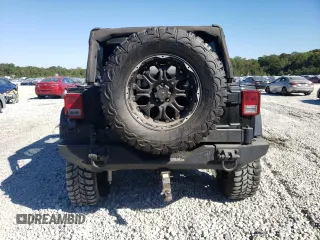 2007 Jeep Wrangler Unlimited Sahara with VIN 1J4GA59197L141821, listed as a Copart auction lot 76897044 with 124,070 mi miles and Salvage title. Bid and sale history available at DreamBid. Image 6.