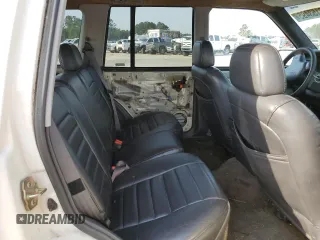 1996 Jeep Grand Cherokee Laredo z VIN 1J4EX58S3TC144191, wystawiony jako Copart lot #53153495 z przebiegiem 197 853 mil mil oraz Szkoda całkowita • Salvage title. Historia ofert i sprzedaży dostępna na DreamBid. Obrazek 10.