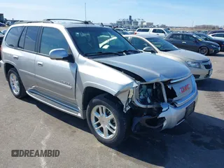 2006 GMC Envoy Denali with VIN 1GKET63M762312848, listed as a IAAI auction lot 41764304 with 115,854 mi miles. Bid and sale history available at carsss.com. Image 1.