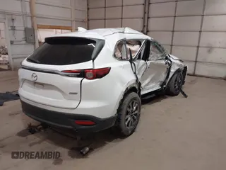 2016 Mazda CX-9 Touring with VIN JM3TCBCY3G0114707, listed as a IAAI auction lot 42023034 with 225,281 mi miles and . Bid and sale history available at DreamBid. Image 4.
