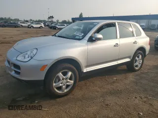2004 Porsche Cayenne S z VIN WP1AB29P24LA66787, wystawiony jako Copart lot #59231435 z przebiegiem 52 815 mil mil oraz Czysty tytuł • Clean title. Historia ofert i sprzedaży dostępna na DreamBid. Obrazek 1.