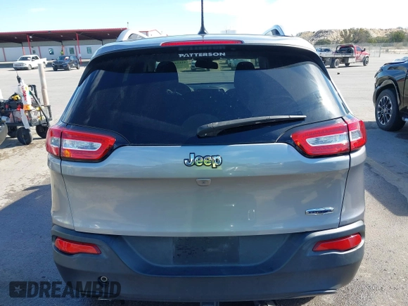 2015 Jeep Cherokee Latitude with VIN 1C4PJLCB8FW620336, listed as a IAAI auction lot 41634997 with 130,335 mi miles. Bid and sale history available at carsss.com. Image 17.