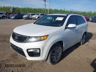 2011 Kia Sorento SX with VIN 5XYKWDA29BG121492, listed as a IAAI auction lot 42144446 with 203,556 mi miles and . Bid and sale history available at DreamBid. Image 2.