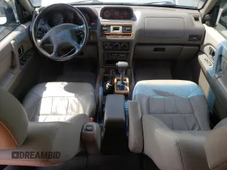 1998 Mitsubishi Montero z VIN JA4MR51RXWJ006418, wystawiony jako Copart lot #54878275 z przebiegiem 225 110 mil mil oraz Szkoda całkowita • Salvage title. Historia ofert i sprzedaży dostępna na DreamBid. Obrazek 8.