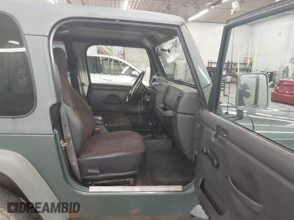 1999 Jeep Wrangler Sport with VIN 1J4FY19S0XP496555, listed as a IAAI auction lot 42110414 with 125,500 mi miles. Bid and sale history available at carsss.com. Image 5.