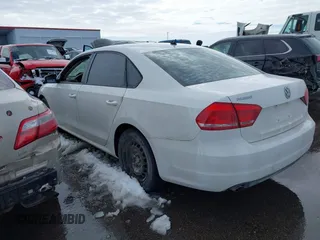 2015 Volkswagen Passat 1.8T Limited Edition with VIN 1VWAT7A3XFC061034, listed as a IAAI auction lot 41730463 with 104,323 mi miles. Bid and sale history available at carsss.com. Image 3.
