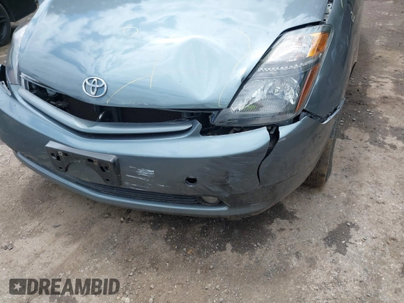 2005 Toyota Prius z VIN JTDKB20U853125464, wystawiony jako IAAI lot #42324259 z przebiegiem 166 742 mil mil oraz . Historia ofert i sprzedaży dostępna na DreamBid. Obrazek 6.